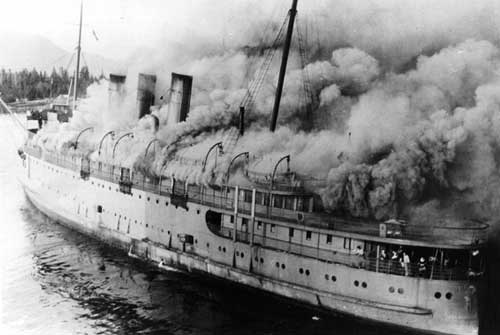 Smoke billows from the steamship Prince George