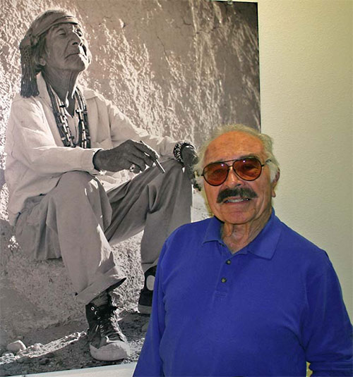 jpg Acclaimed Laguna photographer Lee Marmon stands next to an enlarged version of his most well-known image, "White Man's Moccasins" (1954) at the Indian Pueblo Cultural Center in Albuquerque, New Mexico (February, 2006)
