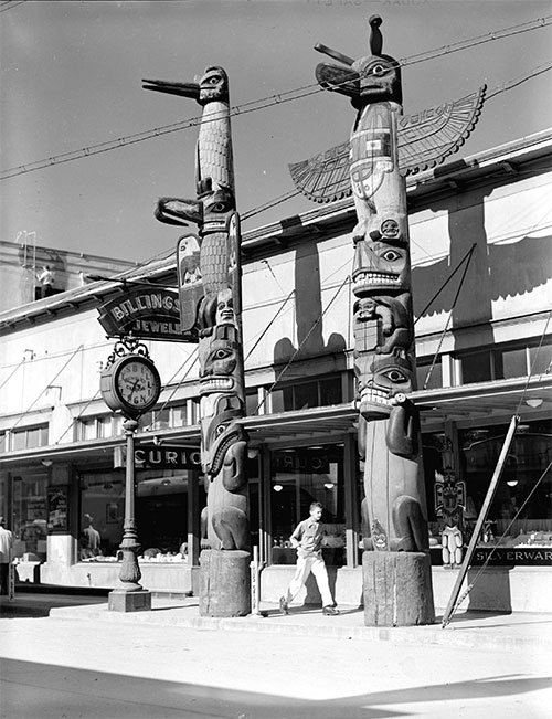 jpg View of totem poles in front of Billingsley Jeweler, Ketchikan - Sept 1949