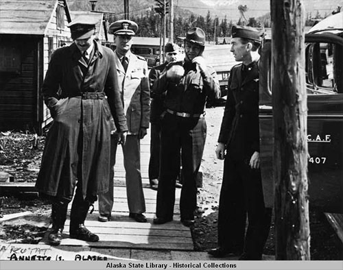 jpg Five men, all in uniforms, on wooden sidewalk at Annette Island, Alaska, April 1942