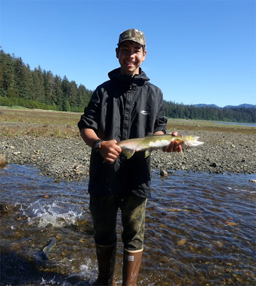 jpg Beebuks Kookesh stands with a salmon he caught with his hands in a stream on Admiralty Island. 