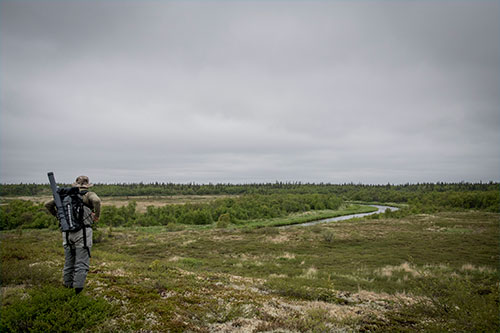 jpg Triston Chaney scopes out fishing potential at Moraine Creek on the sportfishing opener in Bristol Bay.