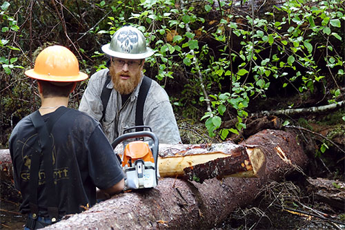 jpg Cody Ellison and Quinn Aboudara of the Klawock Indigenous Stewards Forest Partnership (KISFP) consult on next steps for getting this particular log pictured into place. 