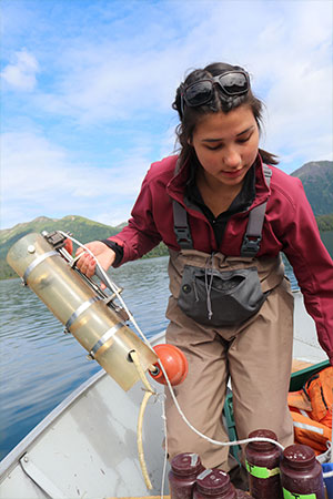 jpg Danielle Lowrey, a University of Alaska Southeast student and Bristol Bay Native Association intern from Bethel, prepares a Van Dorn, which takes water samples that will later be filtered for algae concentration, on Kulik Lake in the Bristol Bay watershed 