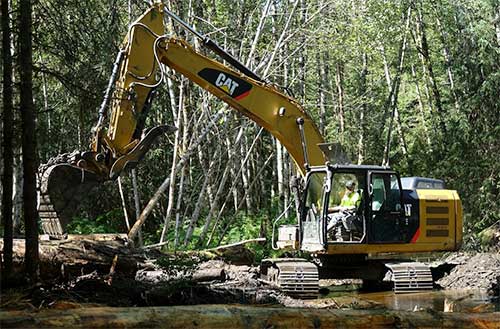 jpg Petersburg’s Rock-N-Road Construction had several employees on the East Ohmer Creek restoration project. Pictured is Jode Coil at work.