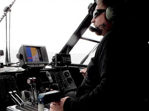 jpg Jim Leslie, owner of Alaska Waters Inc., piloting a  jet boat on the Sitkine River near Wrangell.